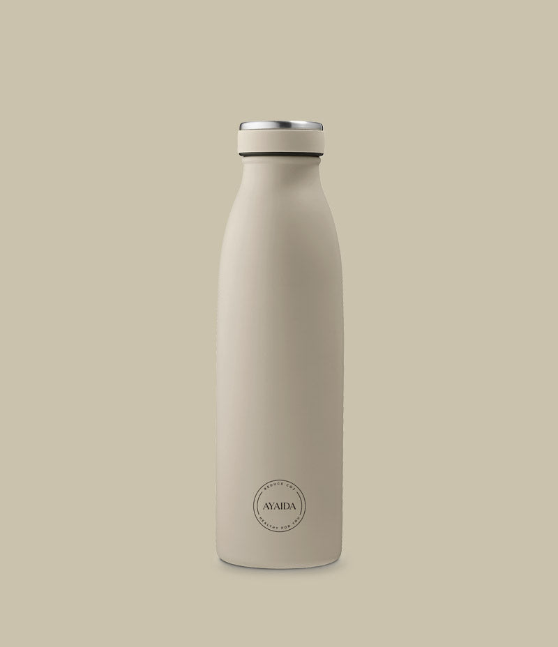 Image shows a beige reusable water bottle against a light coloured background. To the bottom of the bottle is an Ayaida logo within a circle. The bottle has an aluminium lid. Ayaida 500ml beige reusable water bottle - Nor–Folk