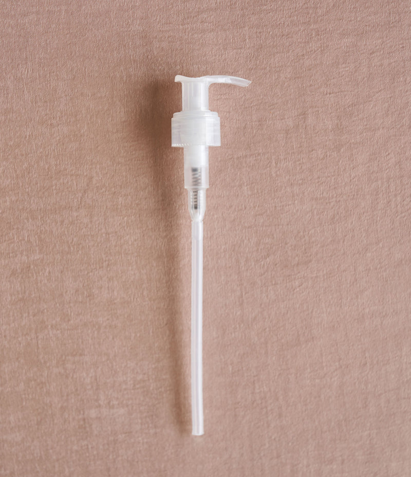 Image shows a white 250ml reusable pump against a light brown background  - Nor–Folk